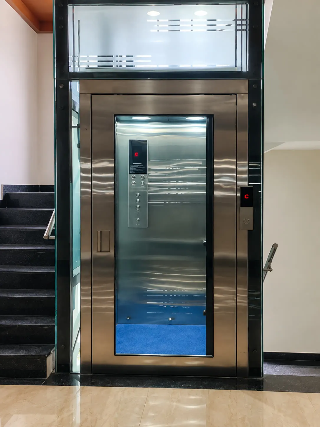 Mirror-finish glass enclosure home lift